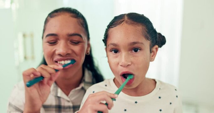 Brushing teeth, mother and daughter with toothbrush and dental for health, morning routine and happy face. Healthy, hygiene and portrait, woman and young girl, oral care and cleaning mouth at home