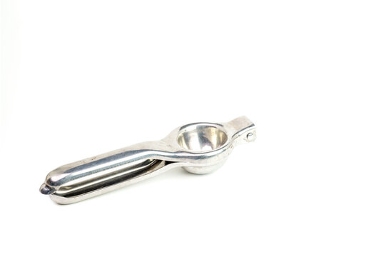 Hand squeezed lemon squeezer on white background