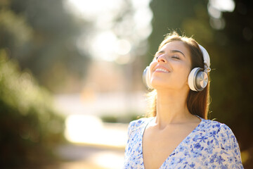 Woman relaxing mind breathing with headphone