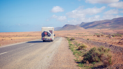 Obraz na płótnie Canvas road trip in motorhome in desert landscape- travel destination, adventure, wanderlust concept