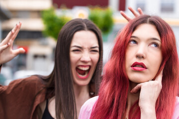angry women arguing in the street