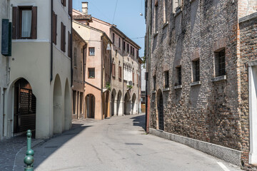 old houses on bending street, Treviso, Italy