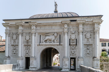 Fototapeta na wymiar facade of san Tomaso monumental entrance in city walls, Treviso, Italy