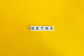 Detox Word on Letter Tiles on Yellow Background. Minimal Aesthetic.