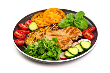 Fried chicken drumsticks served with grilled eggplants, isolated on white background.