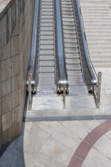 steps of steel escalators at underpass , Stuttagrt, Germany