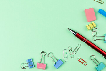 School supplies to on pastel green background