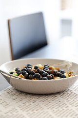breakfast bowl with greek yoghurt, blueberries, granola and a diced apple, healthy fitness food breakfast