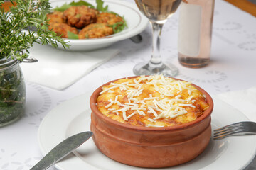 Traditional greek moussaka prepared in clay pot