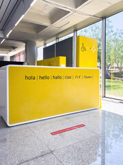 At Palma de Mallorca Airport, a yellow sign by the help desk provides clear communication for transportation. © ifeelstock