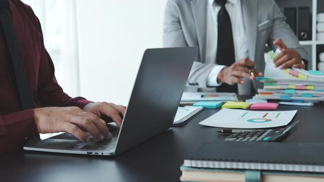 Business adviser analyzing financial figures denoting the progress in the work of the company.