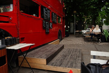  red London bus converted into a cafe in the park. High quality photo © Anastasiia