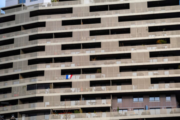 A French apartment building, with a skyline stadium in view. A championship match inspires...