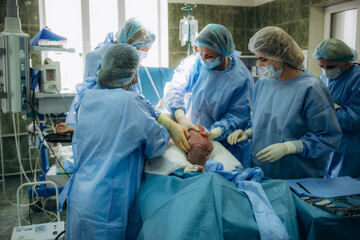 Doctor surgery team in the operating room of abdominal cesarean section during child birth at patient nurse emergency hospital.