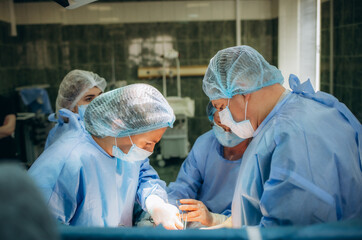 a group of doctors during cesarean births.