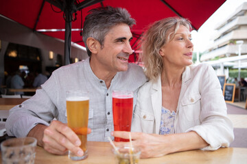 couple man and woman drink a refreshing and cold beer - Powered by Adobe