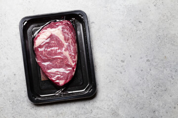 Vacuum packed beef steak. Raw ribeye steak