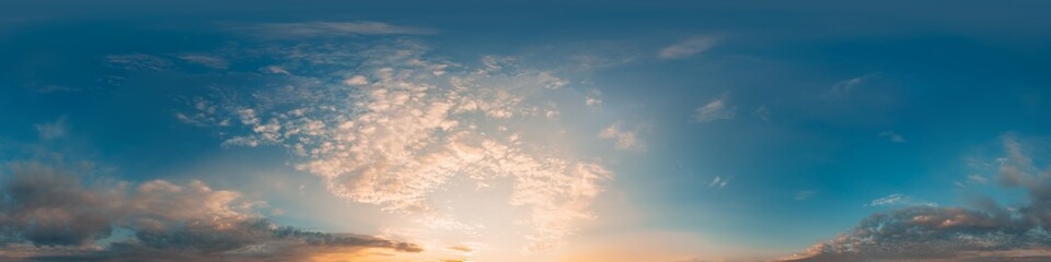 Bright sunset sky panorama with glowing red pink Cumulus clouds. HDR 360 seamless spherical...