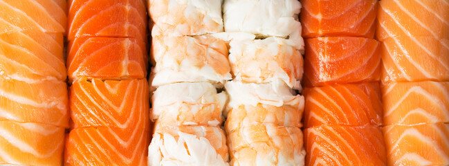 Japanese food, set rolls in king prawn, rolls in smoked eel with unagi sauce and Philadelphia rolls with salmon 2