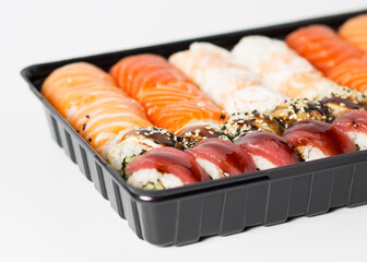 Japanese food, set rolls in king prawn, rolls in smoked eel with unagi sauce and Philadelphia rolls with salmon 4