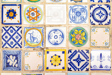 Italian maiolica background, tin-glazed tiles decorated in blue and yellow colours on a white background. Or azulejos, majolica with geometric or figurative elements.