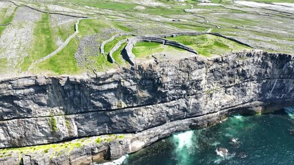 Drone Circling Dun Angus Fort Aran Islands  Ireland perilous perched on a sheer sea cliff on the Atlantic Ocean,the largest of the prehistoric stone forts on the Aran Islands