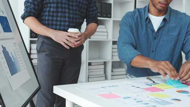 Business adviser analyzing financial figures denoting the progress in the work of the company.