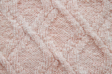 Handmade knitted material with detail woven threads.