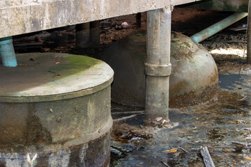 Concrete containers for sewage and waste water under the building on pillars