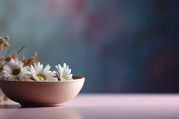Front view with glass filled with flowers on top of the table and gradient background