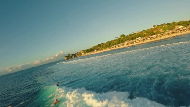 fpv drone flight over surfers in bali
