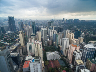 Manila Cityscape, Makati City with Business Buildings and Cloudy Sky. Philippines. Skyscrapers in Background.