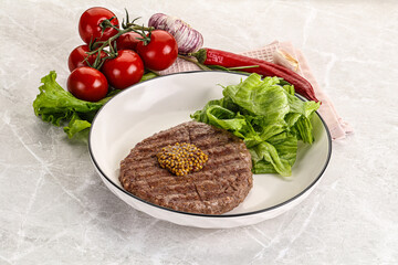 Frilled beef burger cutlet with iceberg