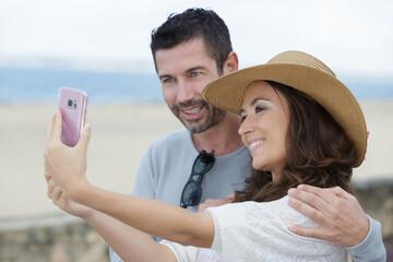 happy middle-aged couple in love take a selfie