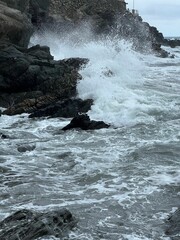 Scenic view of a rocky beach against sea waves