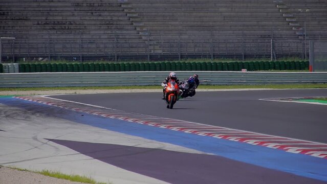 driving school. A racing track has been opened, where motorcycle riding trainings are held. Honda moto. A group of motorcyclists. Slow motion. Moto sport Italy Misano