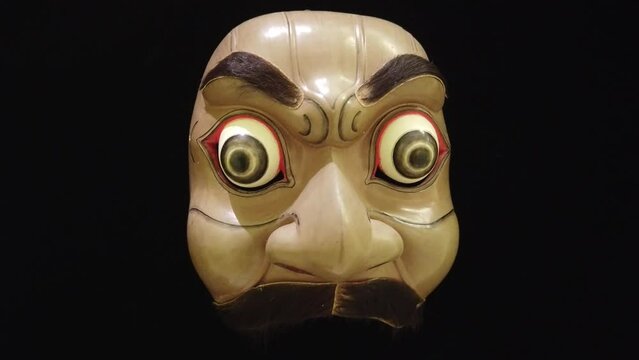 Scary Mask of Topeng Dance Drama, Wooden Art of Bali Indonesia Black Background