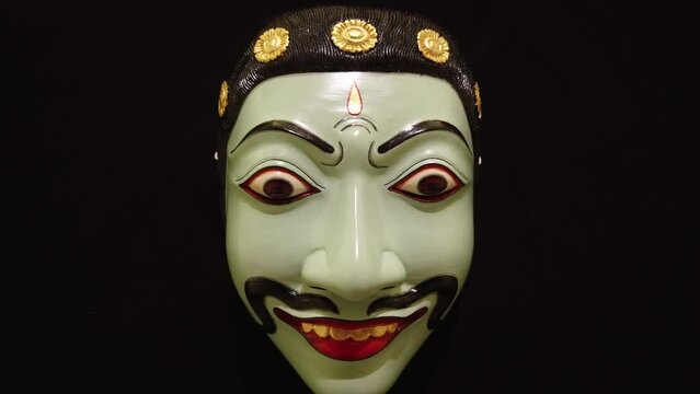 Wood Carved Traditional Mask of Evil Man, Topeng Bali Indonesia Drama Theatre, Infinite Black Background