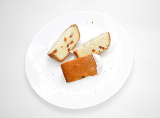 easter cake with raisins isolated on a ceramic plate