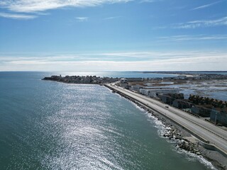 Beautiful seascape featuring a body of water situated next to a pristine sandy Hampton beach