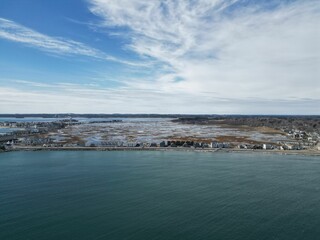 Beautiful seascape featuring a body of water situated next to a pristine sandy Hampton beach