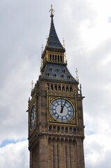 Historic Big Ben clock tower in London, England against a cloudy sky