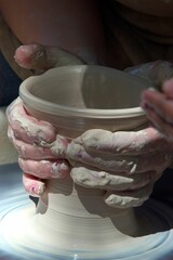 the person uses a pottery pot to create something else in the process