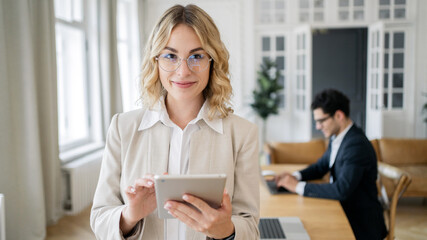 Works in the office of a career administrator, a blonde woman with glasses, a businesswoman in a...