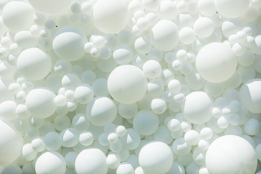 white balloons lit by the sun