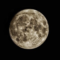 Stunning full moon illuminating the night sky, with wispy clouds and stars twinkling