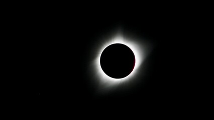 Beautiful night sky lit up by a glowing solar eclipse - perfect for wallpapers
