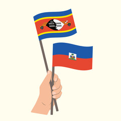 Flags of Eswatini and Haiti, Hand Holding flags