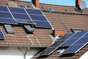 Solar panels on generic house roof. Photovoltaic energy generation near Essen, Germany.