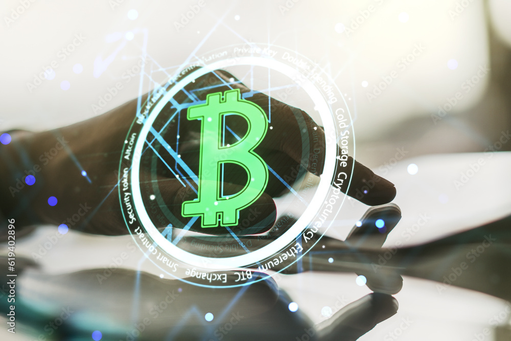 Poster double exposure of creative bitcoin symbol hologram and hand working with a digital tablet on backgr
